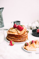 Thin pancakes with milk in a plate. crepes 