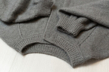 Knitted women's sweater on a white background