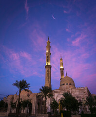 Beautiful large Islamic mosque at the sunset sky background