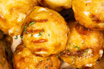 It is a round-roasted takoyaki dish with octopus in flour dough