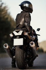 Motorcyclist on his motorcycle on the road. Man on a modern sport bike. Freedom and adventure...