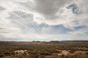 Fototapeta na wymiar Scenic desert landscape with dry ground and blue sky in Spain