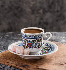 Turkish Coffee with traditional porcelain cup. Coffee with Turkish delight.