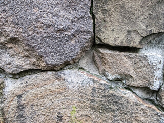 Old stones close up. An ancient structure.
