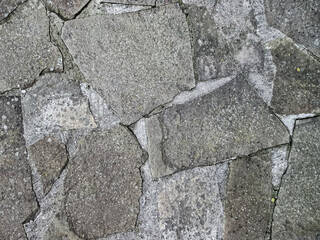 Covered with old cobblestones.