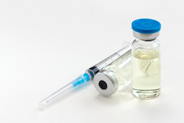 Medicine bottle for injection and syringe for vaccination isolated on white background.