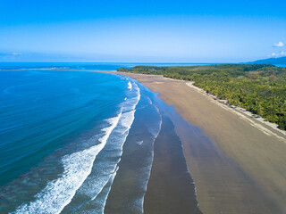 Fototapeta na wymiar Aerial view of the Whale's Tail at the Marino Ballena National Park in Uvita, Costa Rica. Beach is in the shape of a whale tail
