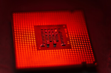 Close-up of CPU Chip Computer Processor in the lab with red dramatic toned. Selective Focus. Overheated tech trouble background concept. 