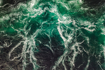 Waves of water of the river and the sea meet each