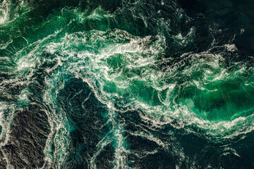 Waves of water of the river and the sea meet each