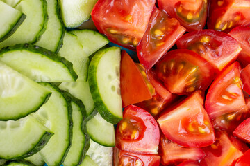 Coarsely chopped fresh vegetable salad in a large plate.