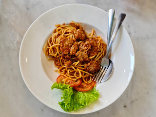 High Angle View of Spaghetti with Minced Pork on White Plate