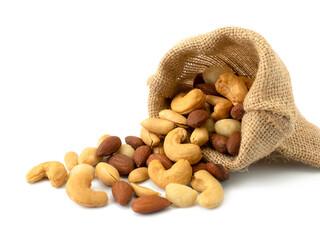 Nuts in sack bag isolated on white background. Various nuts (almonds, macadamia, cashew, peanuts). Mix nut healthy ingredients food.