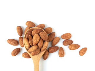 Organic almonds in wooden spoon and heap almonds isolated  top view on white background for almond nuts can improve health concept.