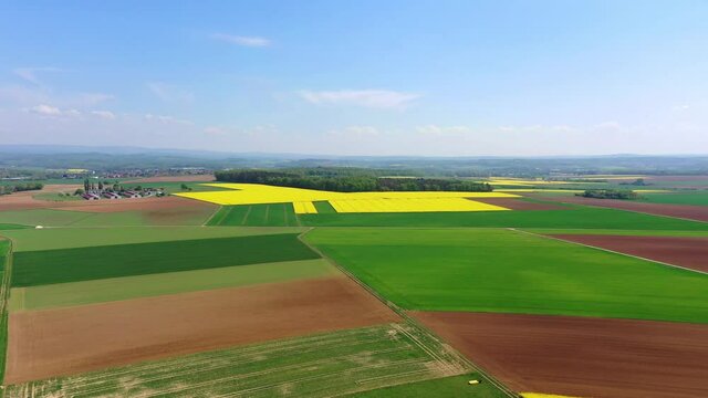 Aerial view, Germany, Hesse, Wetterau, Lich region, Munzenberg, flight at agriculture villages with fields and rapeseed