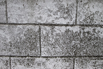 Stacked cinder block slabs with a rough surface. Background with concrete bricks.