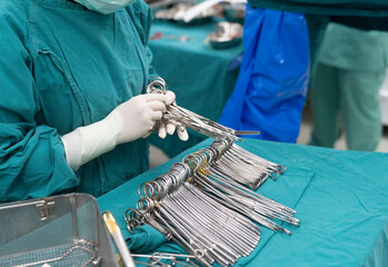 scrub nurse prepare medical instruments for surgery