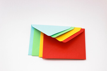 colorful envelopes on isolated white background. Top view. 