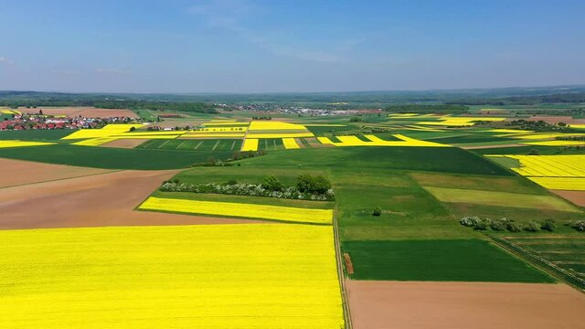 Aerial view, Germany, Hesse, Wetterau, Lich region, Munzenberg, flight at agriculture villages with fields and rapeseed