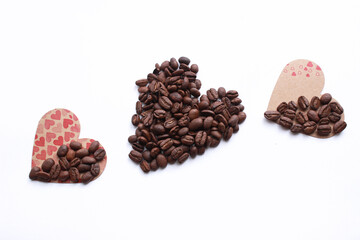 Top view for coffee lovers concept photo Heart shape made from coffee beans and on wooden background.