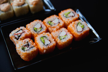 Set of Japanese sushi roll on dark background