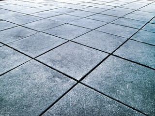 Concrete slabs in perspective. Geometric photo from the central square of the city.