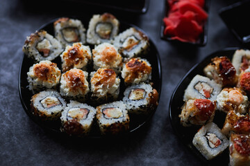 Set of Japanese sushi roll on dark background