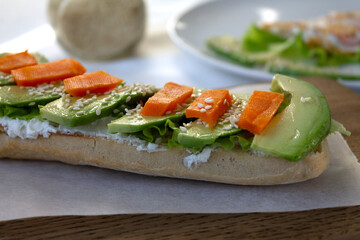 Healthy and nutritious breakfast of wholegrain bread avocado cheese and boiled carrots with egg