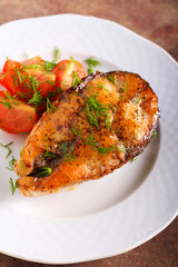 Fried grass carp steak served