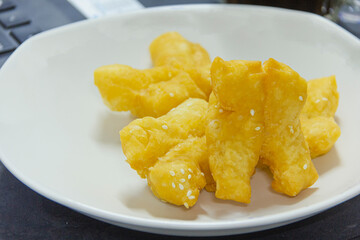 Fried Patongko placed in a white plate, breakfast food