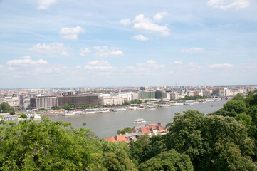 Fototapeta premium Panoramic top view of the Danube river, houses and green trees on a summer day, Hungary.