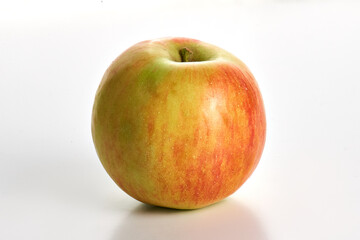 green ripe apple on a white background