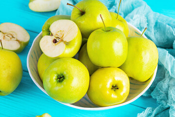 Ripe green apples on a wooden background. Delicious juicy apples