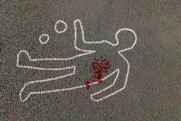 Man silhouette shape outline of dead body marked on road by chalk with evidence circled with blood...