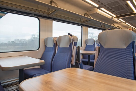 Interior Of An Empty Commuter Train Carriage With Seats