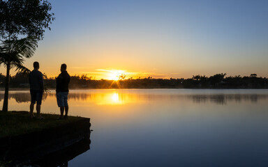 Fototapeta na wymiar Nascer do sol na lagoa de fora na cidade de Balneário Gaivota em Santa Catarina, Brasil.