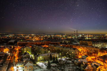 Starry sky over the city of Ivano-Frankivsk in winter