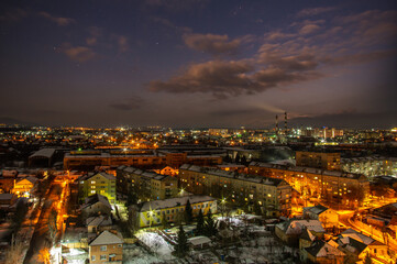 Fototapeta na wymiar Starry sky over the city of Ivano-Frankivsk in winter