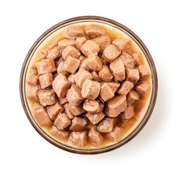 Wet pet food in a plate on a white background, isolated. The view from top