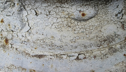 White background with small cracks of peeling paint. Stock texture of an old abandoned wall.