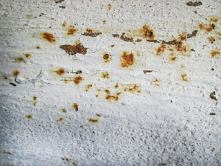 Peeling and rust texture on a white dried wall. Filter for retro poster.