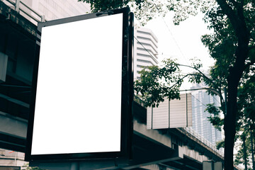 Blank billboard with white space for streets advertising. City view with the blank billboard to insert the pictures.