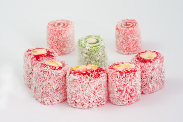Turkish delight in coconut chips isolated on white background