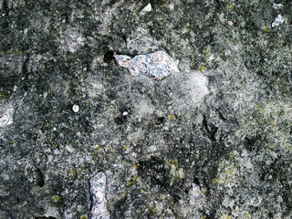 Texture of old stone and concrete. Rough background with bumps and irregularities.