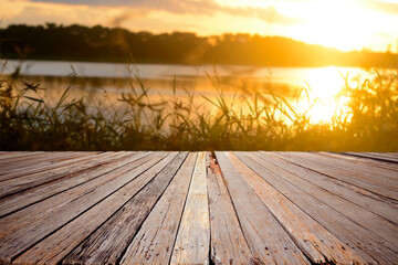 Fototapeta na wymiar Wooden terrace with nature sunset for background