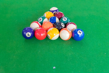 Close-up shot of man is playing pool or Billiard or Snooker Table.