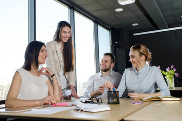 Team of young people in the office working