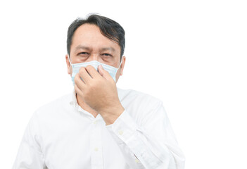 A middle-aged man wearing a white shirt, wearing a mask and covering his nose with his hand. protect coronavirus or covid-19 and air polution concept