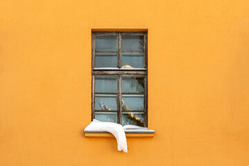 Window with winter frost and snowdrift on windowsill