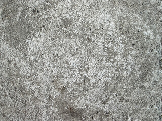 Grainy, granular gray background with concrete. Rough texture of rough cement.